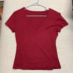Medium extremely low VNeck top. Wine red color and thinner poly material.